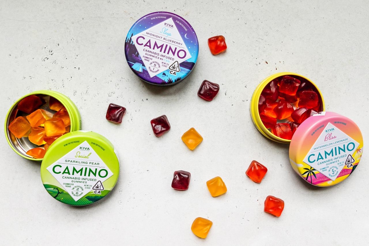 our-story-02 Colorful CBD gummies in Camino branded packaging arranged artfully on a flat surface.